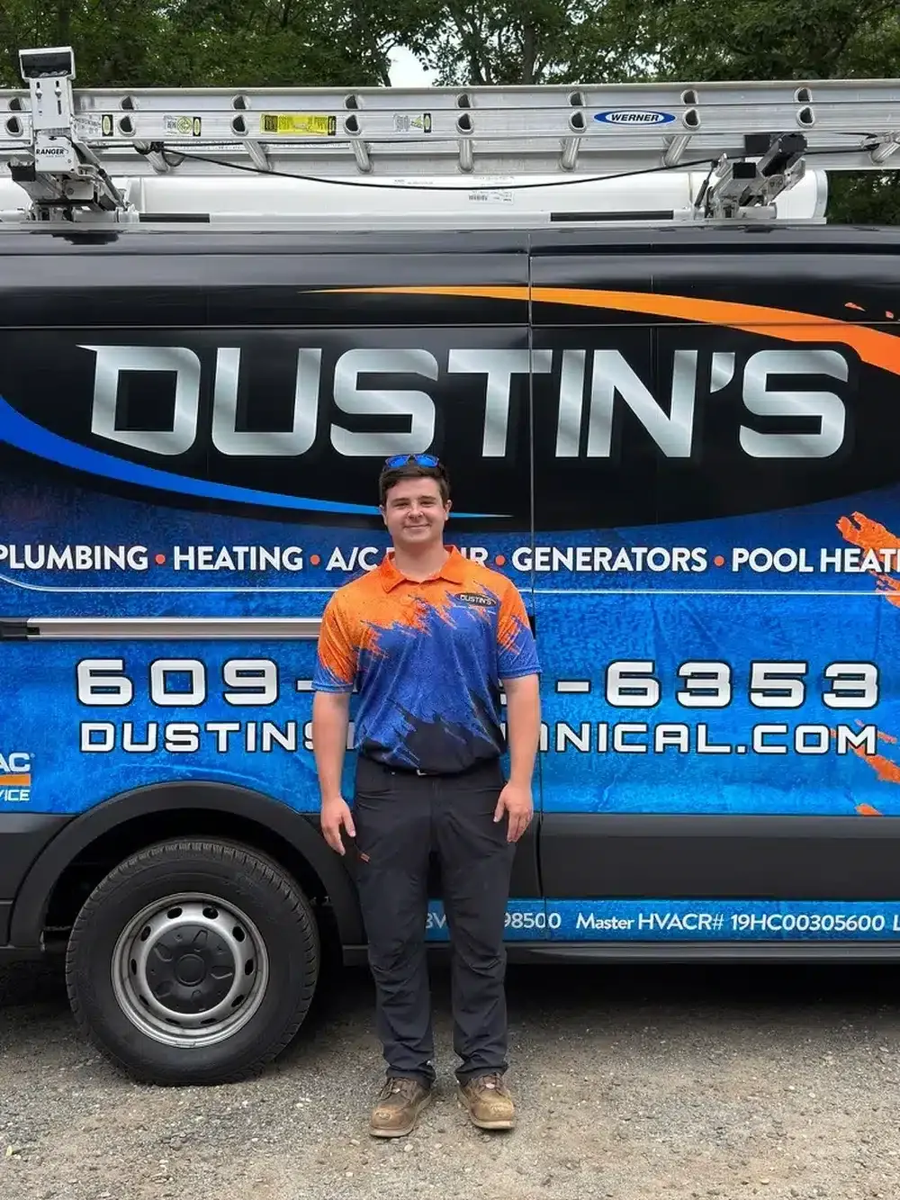 Technician standing in front of dustin's mechanical truck