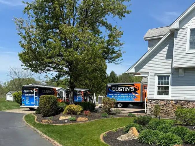 Dustins mechanical trucks outside of residential home in New Egypt