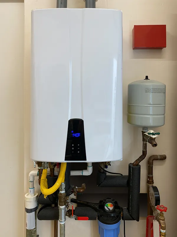 Close-up view of a tankless water heater set at 140F, serving a Dustin's Mechanical customer in New Egypt, NJ