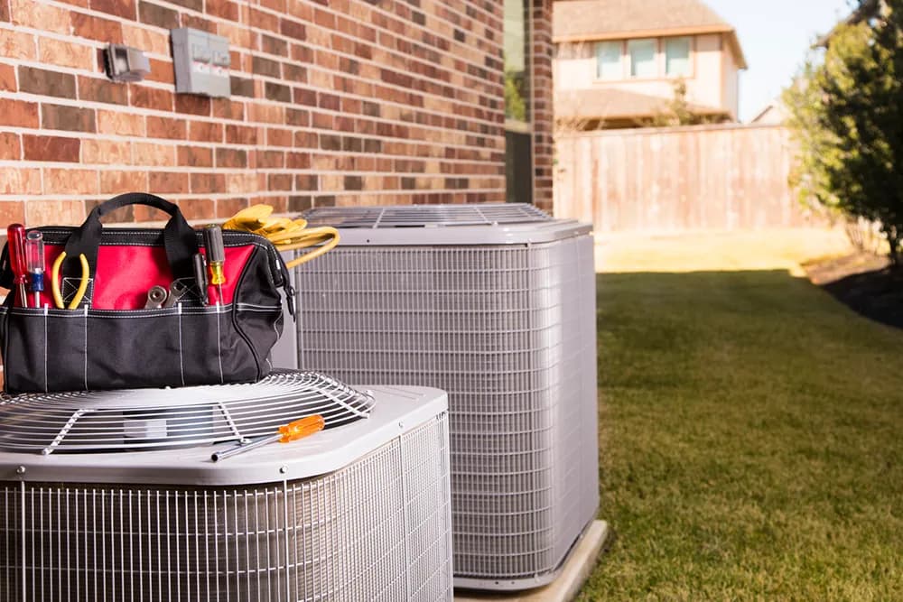 Two air conditioners outside of a residential home in New Egypt