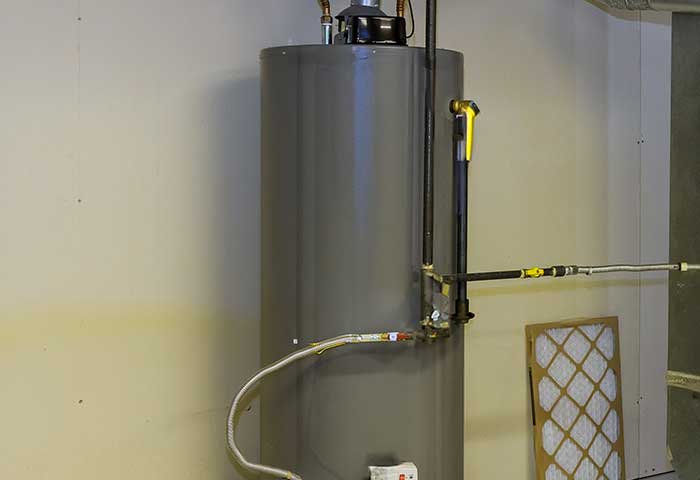 Traditional water heater installed in a utility room