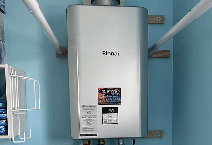 Rinnai tankless water heater installed on a blue wall