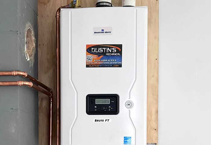 Wall-mounted water heater with copper pipes installed