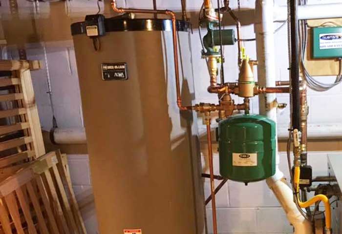 Boiler system with expansion tank and connected pipes
