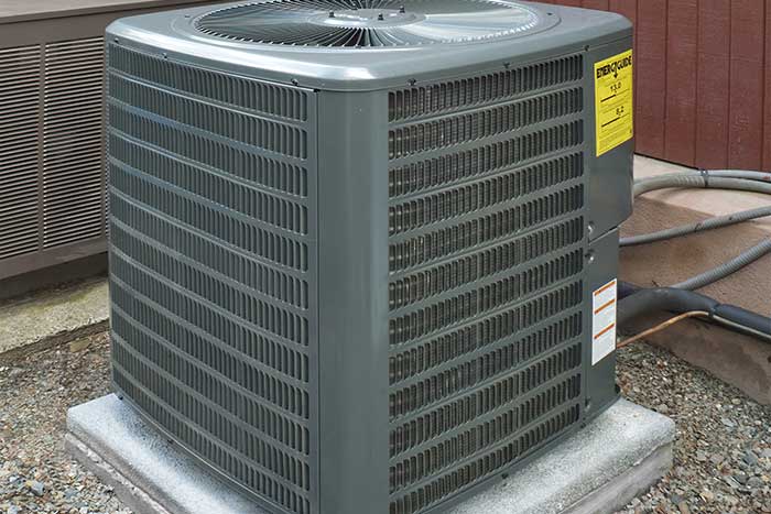 Outdoor air conditioning unit installed on a concrete pad